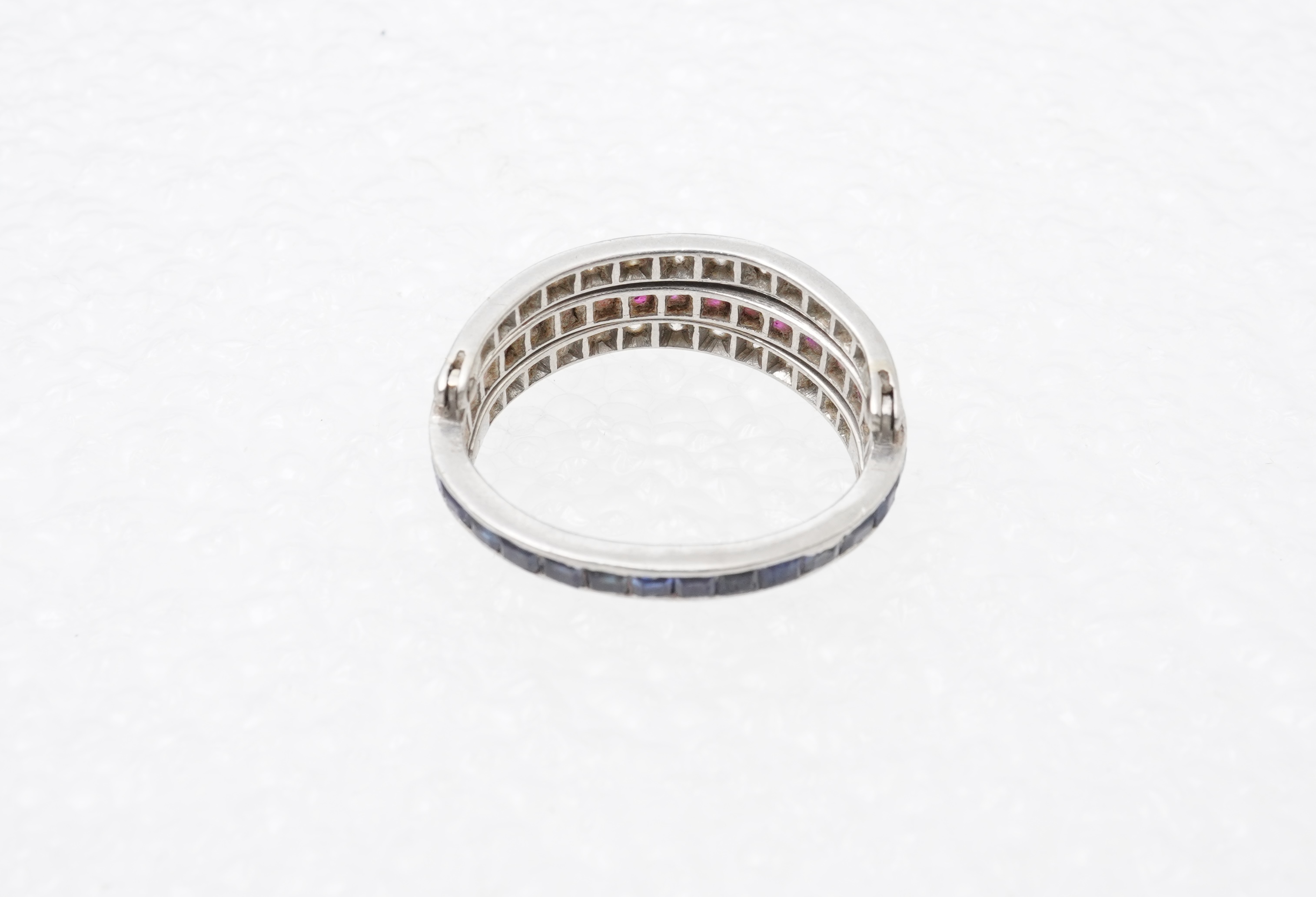 A ruby, sapphire and diamond 'Day and Night' ring, mid 20th century